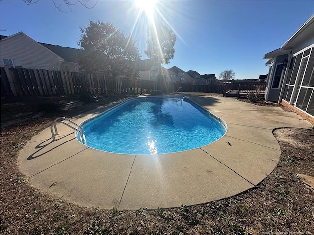 view of swimming pool with a patio