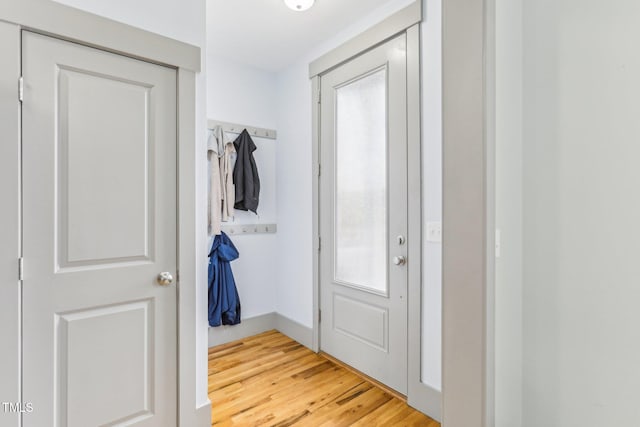 doorway to outside with wood-type flooring