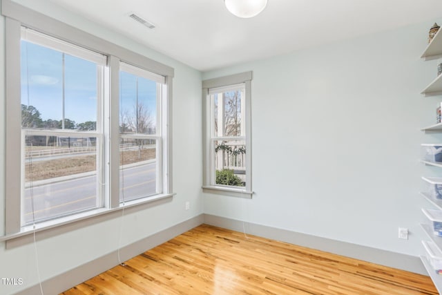 unfurnished room featuring light wood-type flooring