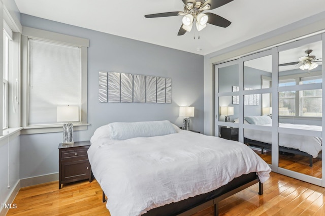 bedroom featuring ceiling fan and light hardwood / wood-style floors