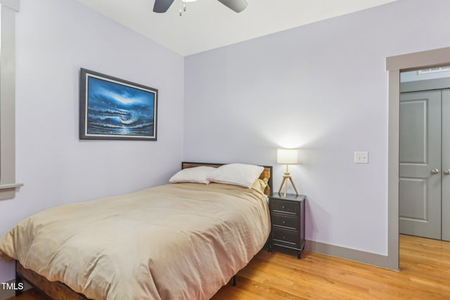 bedroom featuring ceiling fan and hardwood / wood-style floors