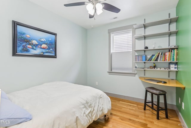 bedroom featuring ceiling fan and light hardwood / wood-style flooring