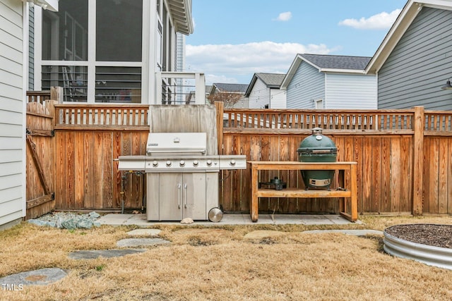 view of patio featuring a grill