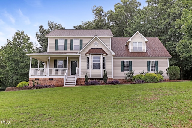 view of front of home with a porch and a front yard