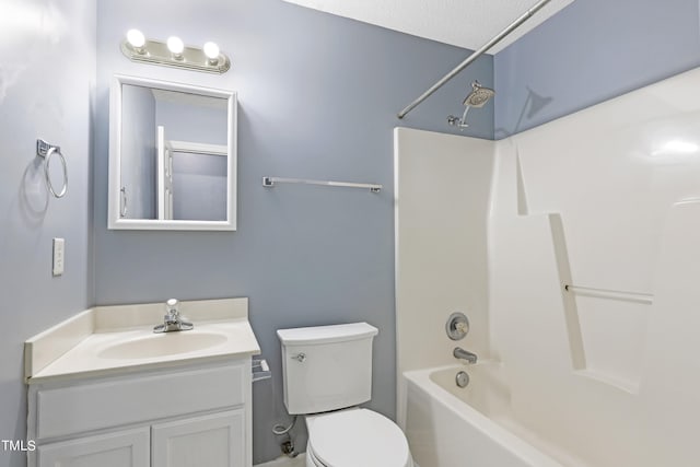 full bathroom featuring vanity, shower / bathing tub combination, a textured ceiling, and toilet