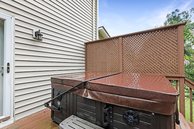 deck featuring a hot tub