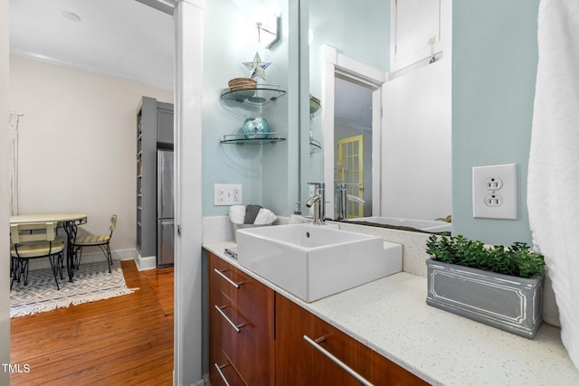 bathroom featuring vanity and hardwood / wood-style flooring