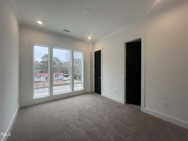 spare room featuring carpet