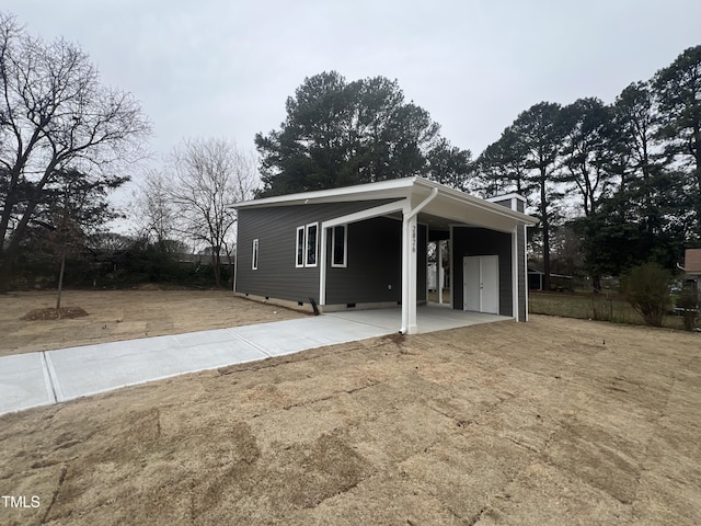 view of front of home with a carport