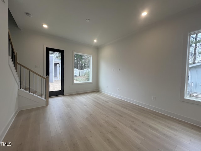 entryway featuring light hardwood / wood-style floors and a wealth of natural light