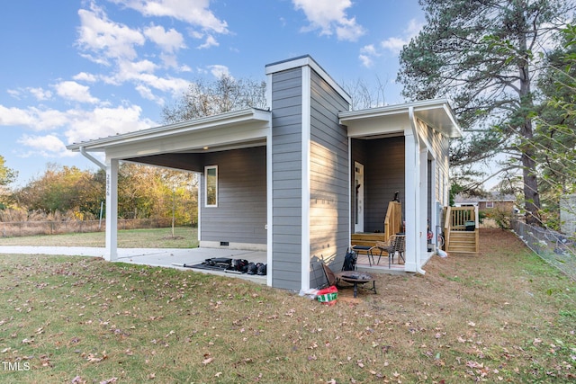 view of home's exterior with a lawn