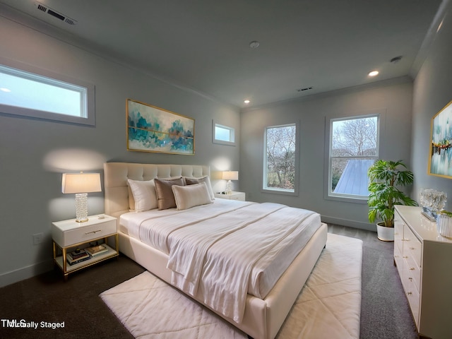 bedroom with crown molding