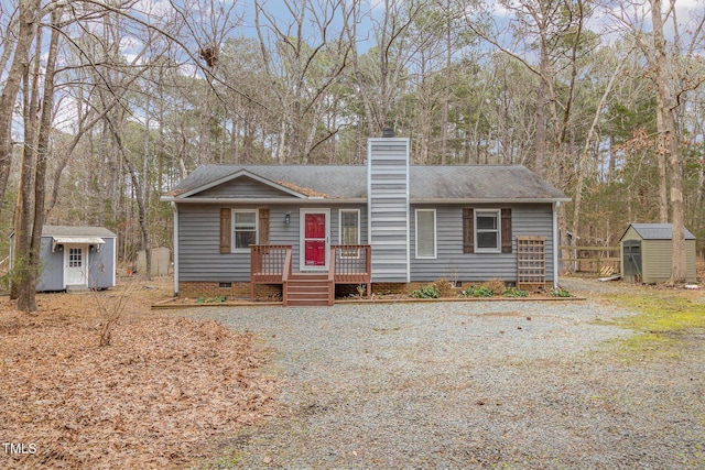 view of front facade featuring a storage shed