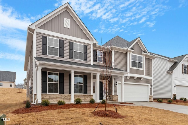 craftsman house with a porch and a garage