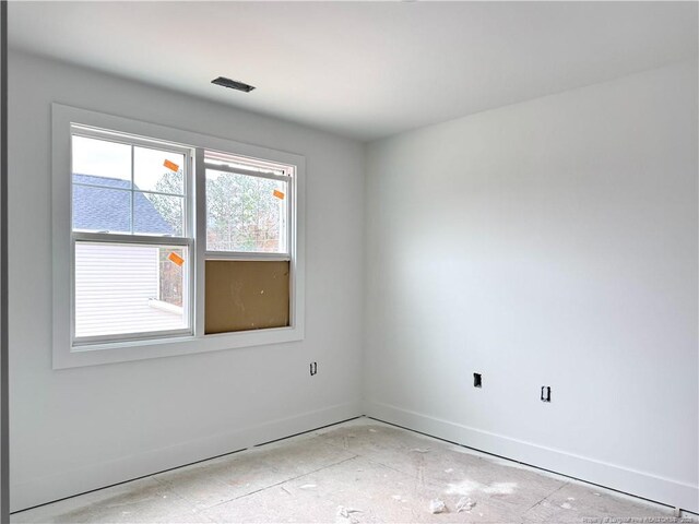 empty room with baseboards