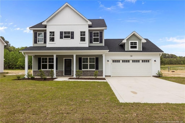 1585 Scull Rd, Raeford, NC 28376 - view of front of house featuring board and batten siding, a garage, a front yard, driveway, and a porch
