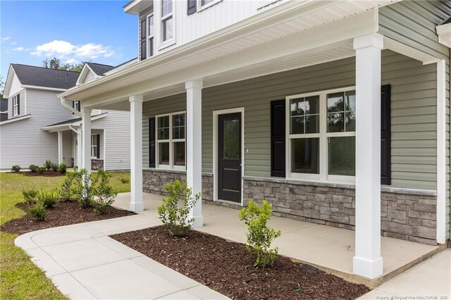 1585 Scull Rd, Raeford, NC 28376 - property entrance with a porch and stone siding