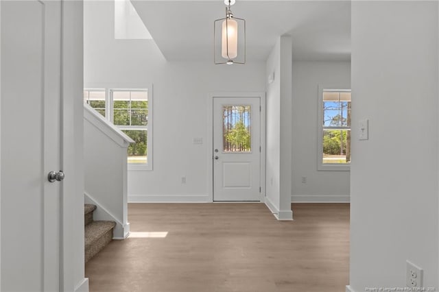1585 Scull Rd, Raeford, NC 28376 - entryway with healthy amount of natural light, stairs, wood finished floors, and baseboards