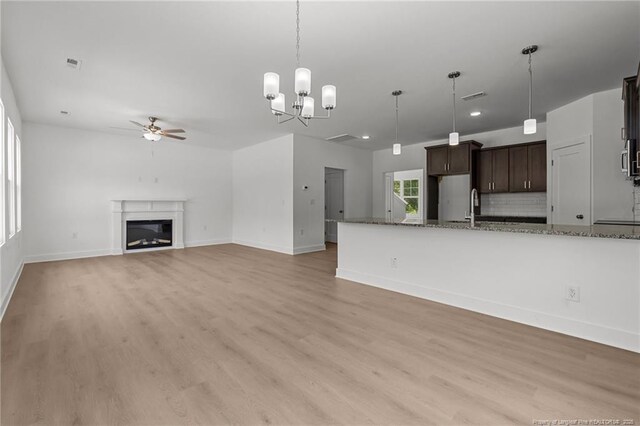 1585 Scull Rd, Raeford, NC 28376 - unfurnished living room featuring ceiling fan, light wood finished floors, baseboards, and recessed lighting