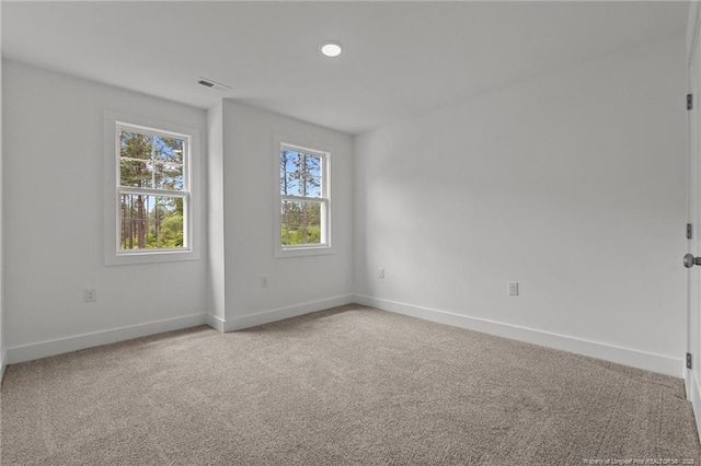 1585 Scull Rd, Raeford, NC 28376 - unfurnished room featuring healthy amount of natural light, baseboards, and light colored carpet
