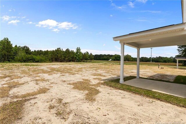 1585 Scull Rd, Raeford, NC 28376 - view of yard featuring a patio area