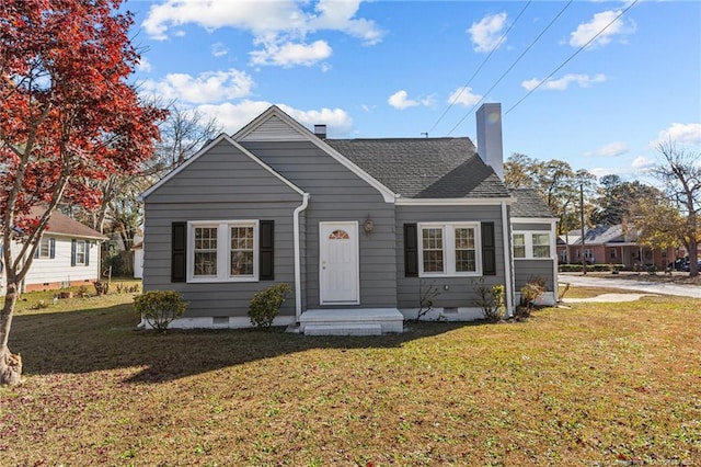 bungalow-style home with a front lawn