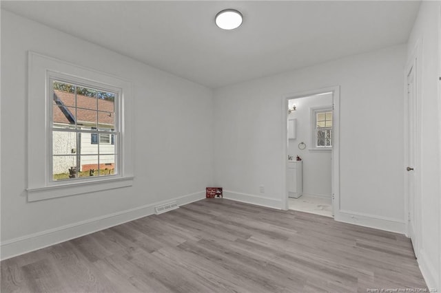 unfurnished room featuring light hardwood / wood-style floors