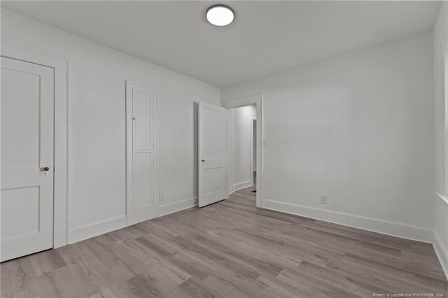 unfurnished bedroom with light hardwood / wood-style floors