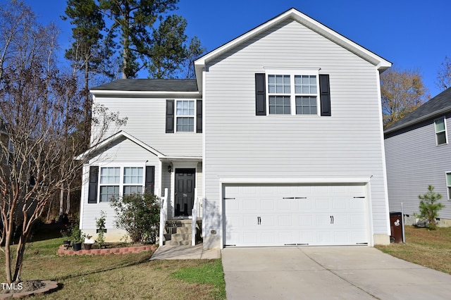 view of front property with a garage and a front lawn