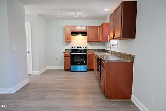 kitchen featuring light wood-type flooring, electric range, dishwasher, and sink