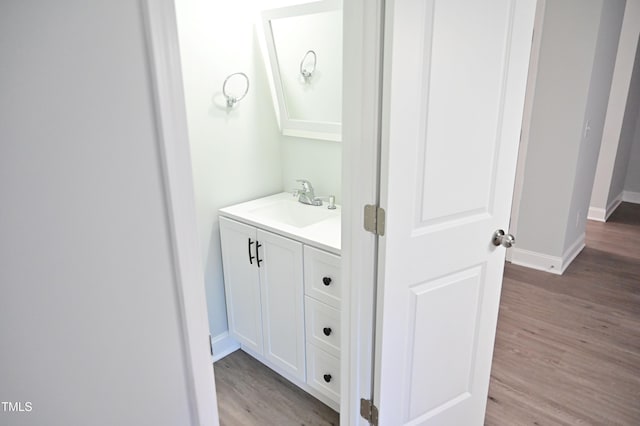 bathroom featuring vanity and hardwood / wood-style flooring