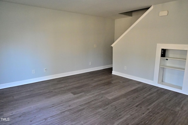 unfurnished room featuring dark hardwood / wood-style floors