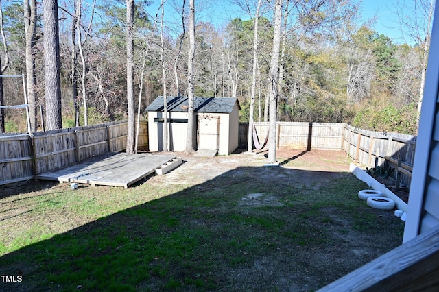 view of yard with a shed and a deck