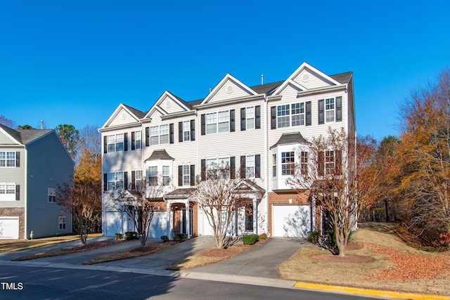 multi unit property featuring a garage