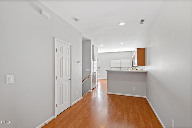 hall featuring light wood-type flooring