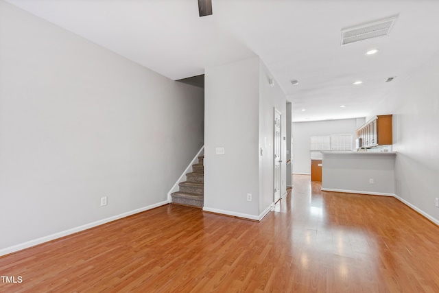 unfurnished living room featuring light wood-type flooring