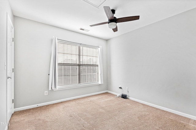 spare room featuring carpet and ceiling fan