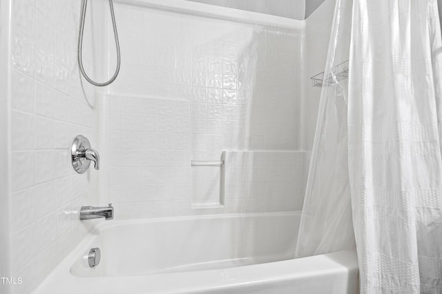 bathroom featuring shower / bath combo with shower curtain