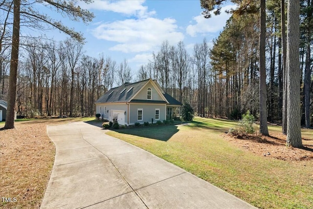 view of side of property with a lawn