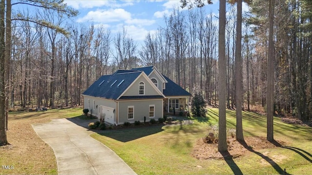 view of front of home with a garage and a front yard