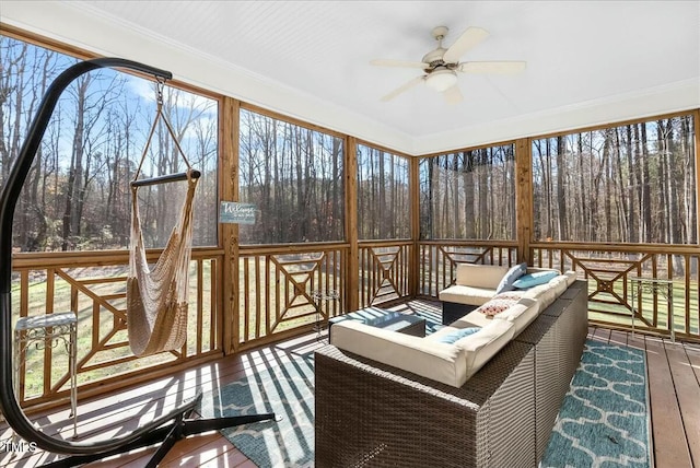 sunroom with ceiling fan