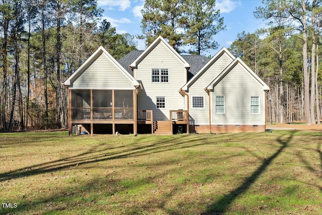 back of house with a sunroom and a lawn