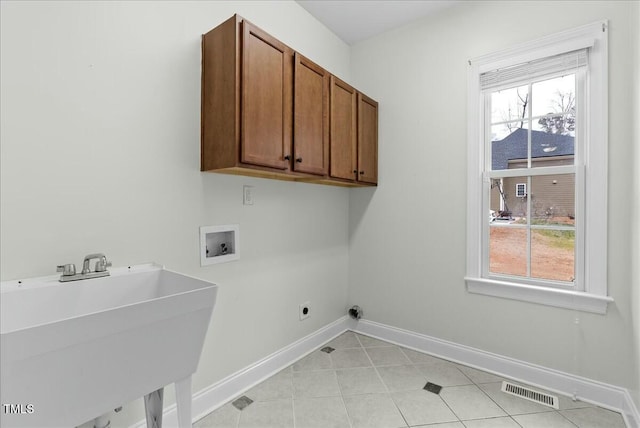 laundry room with washer hookup, hookup for an electric dryer, cabinets, and sink