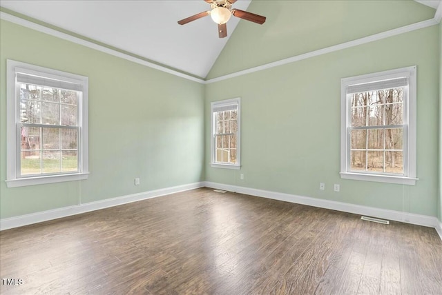 empty room with ceiling fan, hardwood / wood-style floors, ornamental molding, and lofted ceiling