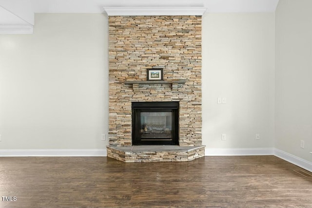 room details featuring wood-type flooring, ornamental molding, and a fireplace