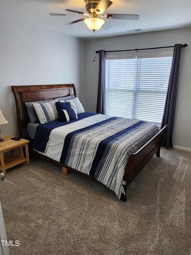 carpeted bedroom featuring ceiling fan