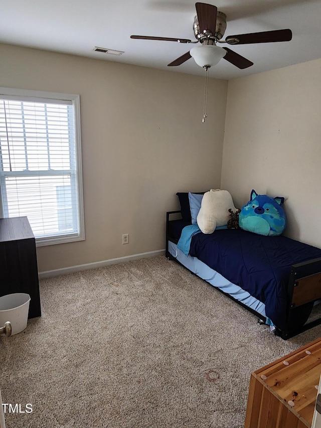 carpeted bedroom featuring ceiling fan