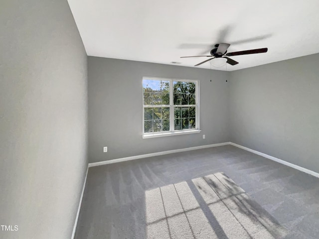 spare room with carpet floors and ceiling fan