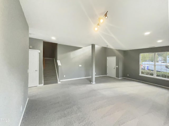 unfurnished living room featuring carpet