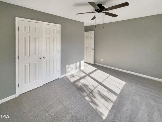 unfurnished bedroom with ceiling fan and a closet